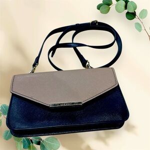 Nine West small size cross-body. Black and tan with gold hardware